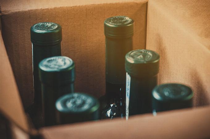 6 wine bottles in cardboard carton